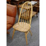 A SET OF FOUR 1960'S ERCOL BEECH AND ELM DINING CHAIRS (97cm high).