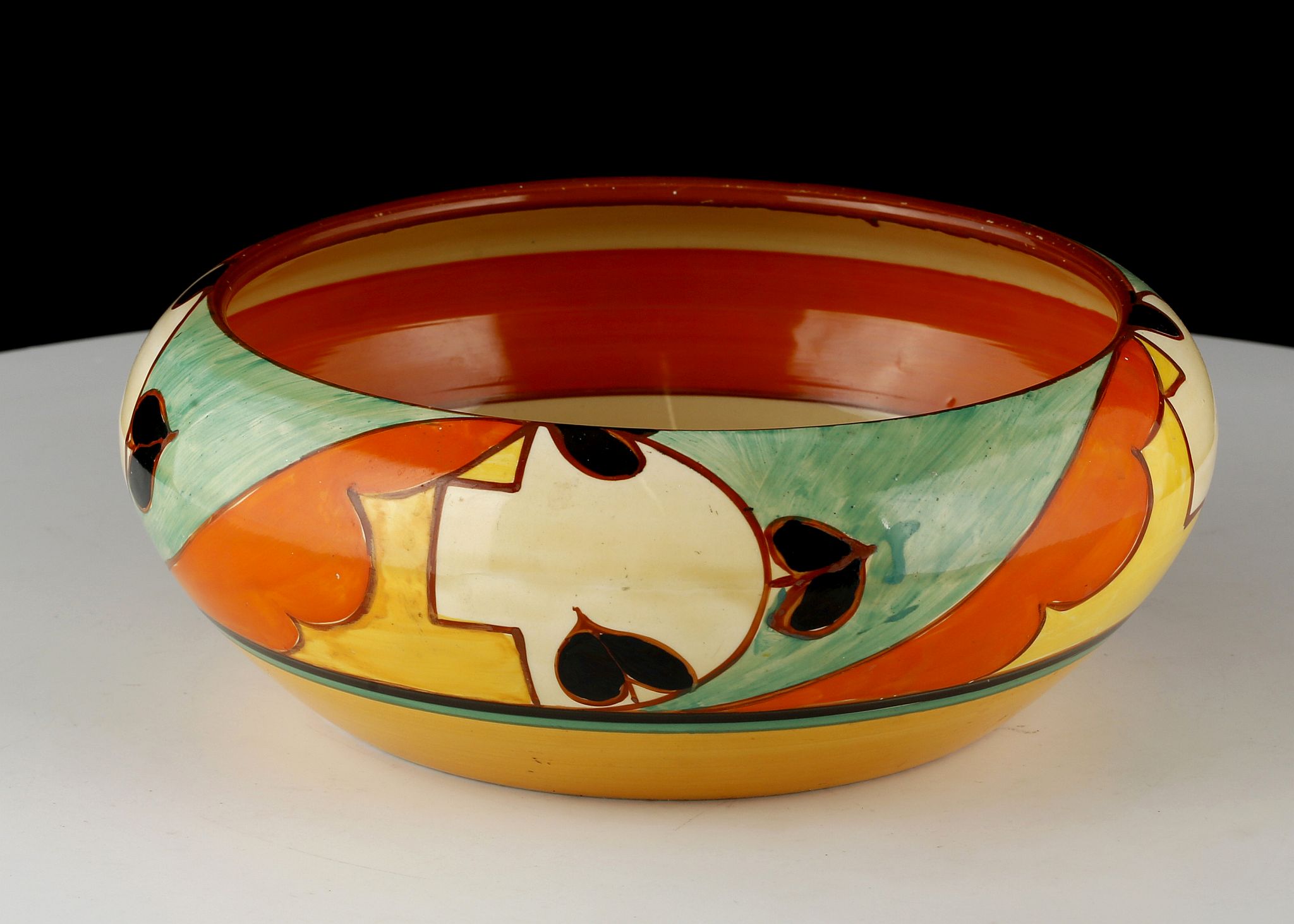 AN ART DECO CLARICE CLIFF FANTASQUE 'HAVRE' SHAPED BOWL, painted in colours between orange, yellow