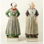 A PAIR OF EARLY 20TH CENTURY PORCELAIN FIGURES OF DANISH WOMEN, wearing regional costumes, enamelled