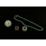 A green jade Chinese puzzle ball, 5.5cm diameter approx. jade necklace with silver clasp, green