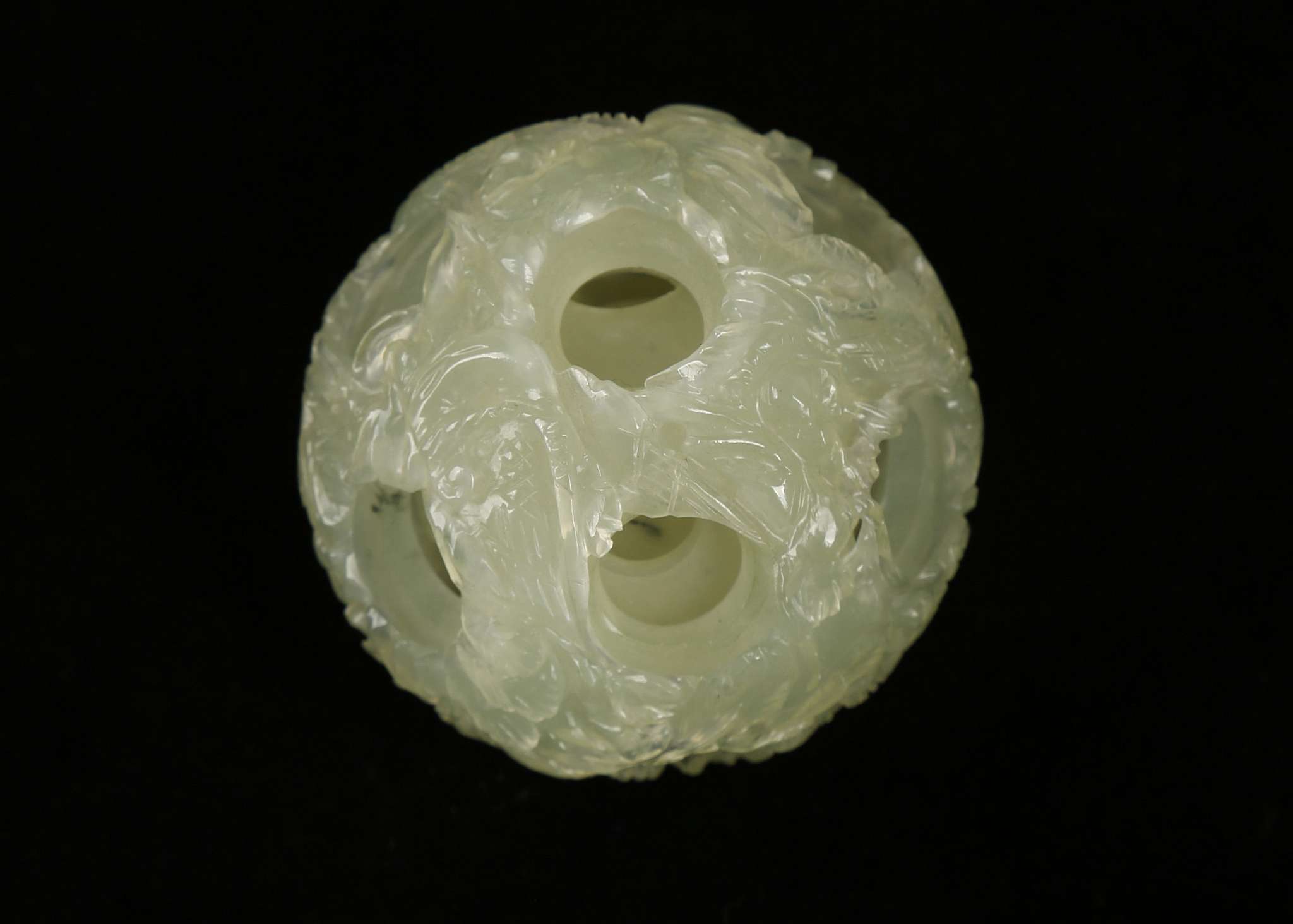 A green jade Chinese puzzle ball, 5.5cm diameter approx. jade necklace with silver clasp, green - Image 2 of 2