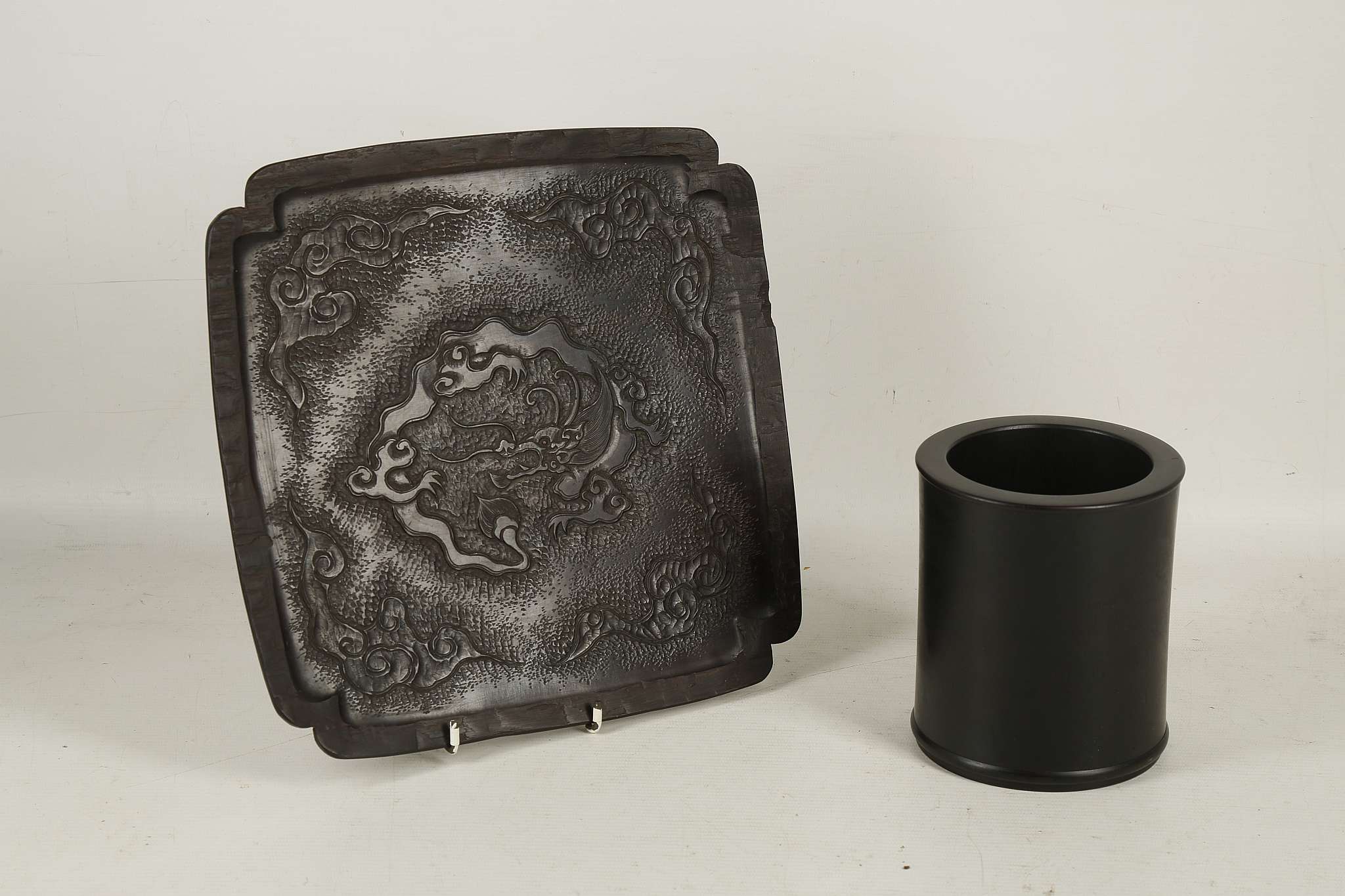 A Chinese hardwood brush pot, 13.2cm high and a Japanese hardwood platter with dragon and cloud
