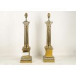 A pair of early 20th Century brass mounted Corinthian shaped lamp bases, fitted for electricity,