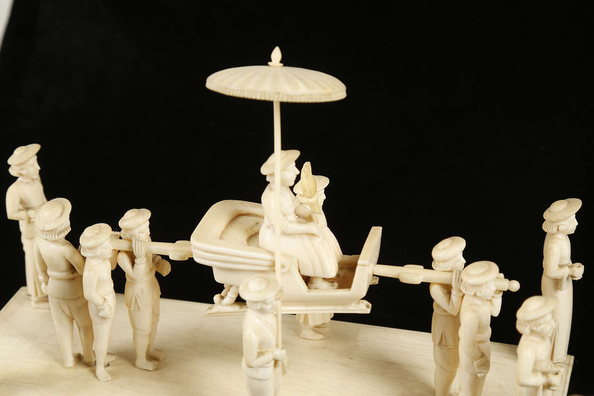 Two Indian ivory and bone carvings, studies of Maharajah's being transported by a team of carriers - Image 2 of 2