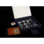 Silver proof and uncut coins; Canadian Dollar 1997, $5 1996, 1998, Guernsey £5 1995, 1997, British