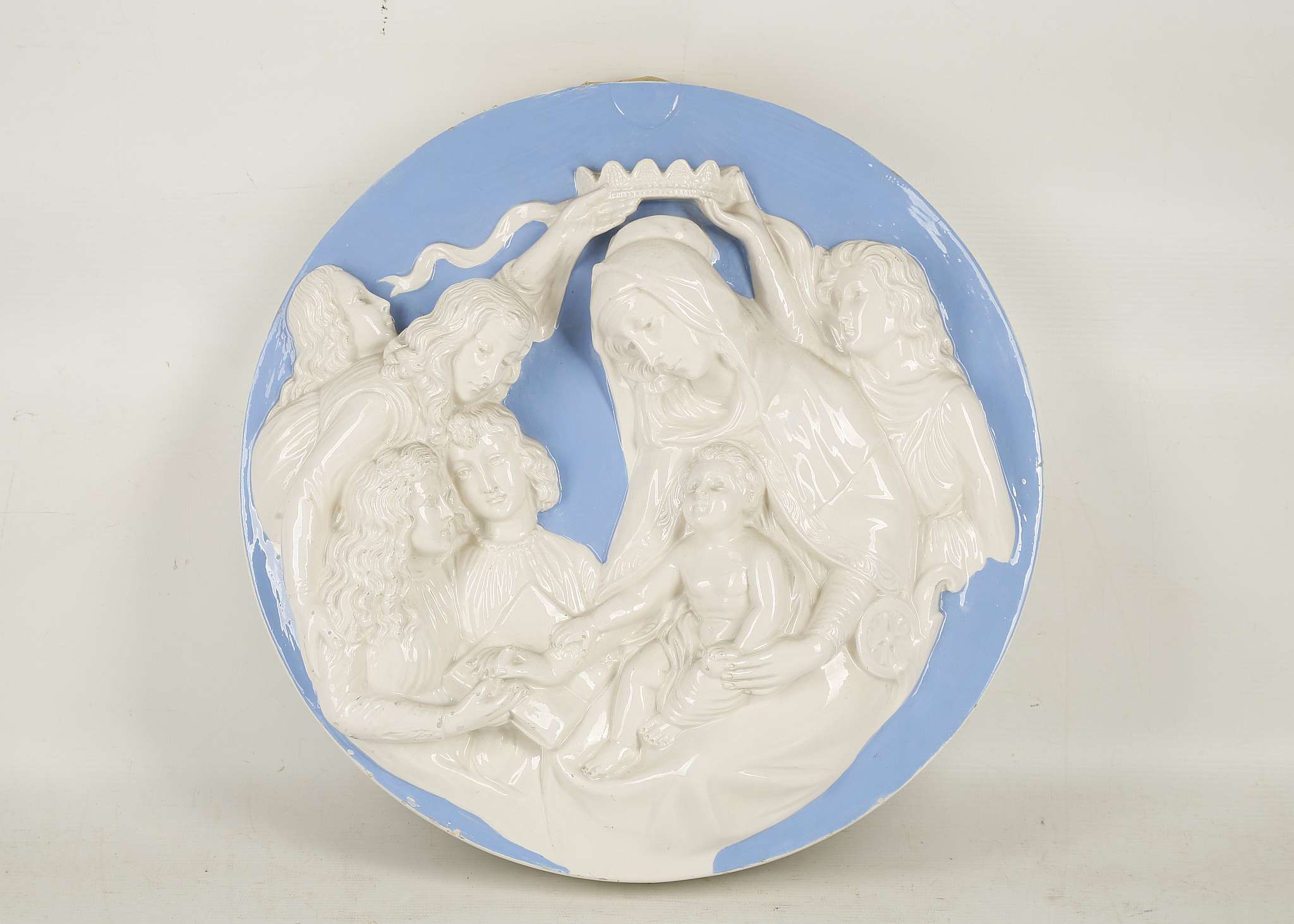 An Italian Della Robbia style earthenware - Maiolica circular wall plaque, polychrome enamel