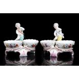 A PAIR OF BERLIN PORCELAIN SALTS OR SWEETMEAT DISHES, late 19th century, both modelled in 18th