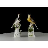 A PAIR OF MEISSEN FIGURES OF BIRDS, early 20th century, both modelled perched upon leafy stumps