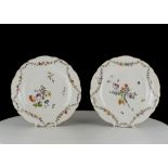 A PAIR OF MEISSEN PLATES, mid 18th century, both finely painted floral sprays and sprigs, the rims