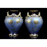 A GOOD PAIR OF LIMOGES TWIN-HANDLED VASES, early 20th century, both elaborately gilded and enamelled