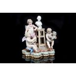 A MEISSEN FIGURE GROUP OF 'THE STUDIO', mid 19th century, after the original by M.V. Acier, modelled