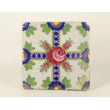 A Turkish 18th Century Isnik tile painted with damascus rose, 9.25cm square.