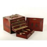 An early 20th Century Chinese Mah Jong set, in a fitted wood case, having sliding front with later