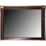 A mahogany framed over mantle mirror having barley twist top rail & sides with gilt, roundels to top