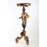 A mid 20th century Venetian polychrome Blackamoor with cartouche shape table top and supported on