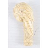 An ivory walking stick handle, carved as the head of a parrot, 19th century
