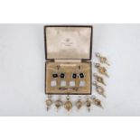A vintage cased mixed set of silver shirt studs, together with ten various gilt metal watch key fobs