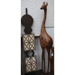 A sizeable wood giraffe, 210cm high, and a large African head crest.