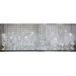 A collection of crystal to include Baccarat Champagne flutes and Waterford cut crystal stemware, and