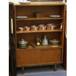 A 1960s danish teak bookcase, with adjustable shelvs above a double cupboard with sliding doors