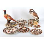 A Royal Crown Derby bone china model of a pheasant painted in naturalistic colours, together with