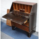 An Edwardian mahogany inlaid bureau, the fall enclosing a fitted interior with three drawers.