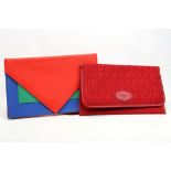 TWO 1980s CLUTCH BAGS, one red Louis Feraud example, the other Ivorie de Balmain multicoloured
