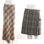 TWO BURBERRY WOOL SKIRTS, one of short kilt design, the other long, both size UK 12 (2)