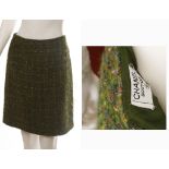 CHANEL GREEN BOUCLE SKIRT, short a-line, no size stated but fits UK 10