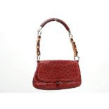 PRADA MINI OSTRICH HANDBAG, rouge ostrich skin with tan leather trim, 26cm wide, 14cm high