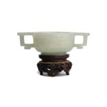 A CHINESE CELADON JADE ARCHAISTIC TWO-HANDLED CUP. Qing Dynasty, 18th / 19th Century. The rounded