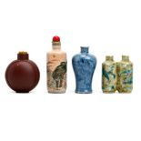 FOUR CHINESE PORCELAIN SNUFF BOTTLES. 19th / 20th Century. Comprising a cat snuff bottle, a ‘Zhong