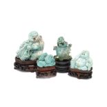 FOUR CHINESE TURQUOISE CARVINGS. 19th / 20th Century. Two carved as seated Buddhas, one miniature