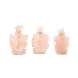 THREE CHINESE CARVED ROSE QUARTZ SNUFF BOTTLES. Qing Dynasty. Each carved and pierced with floral