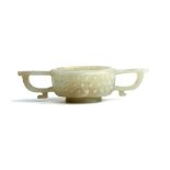 A CHINESE CELADON JADE ARCHAISTIC TWO-HANDLED CUP. Qing Dynasty, 18th / 19th Century. The rounded