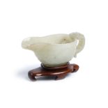 A CHINESE ARCHAISTIC PALE CELADON JADE ‘CHILONG’ CUP, YI. Qing Dynasty, Qianlong era. The archaistic