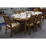 A Bergere rosewood dining table and 6 chairs, including a pair of carvers, the table raised on