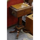 A Regency rosewood teapoy, with fitted interior on sabre legged platform support, 41cm wide.