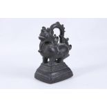 A Burmese bronze weight cast as a mythical beast.