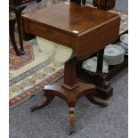 A 19th Century mahogany work table, with drop flaps, sliding silk basket and sabre legged platform