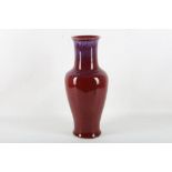 A large Chinese 20th Century baluster shaped flame glazed vase, bearing impressed character mark,