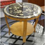 A 1960's circular glass topped coffee table with undertier, 58cm diameter.