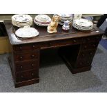 A Victorian stained pine twin pedestal desk.