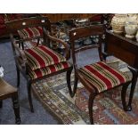 A set of five Regency mahogany bar back dining chairs, including a carver, with drop-in seats on