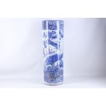 A Japanese porcelain umbrella / stick stand, transfer decorated in blue with swimming carp.