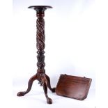 An Edwardian mahogany jardiniere stand, having carved barley sugar column and supported on trefoil