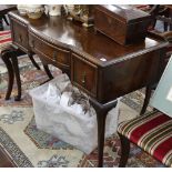 A Waring & Gillow mahogany bow fronted dressing table, 113cm wide.