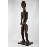 A 20th Century Lobi tribal figure from Burkino Faso, 98cm tall.