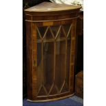 A 19th Century mahogany rocking crib, together with a yew wall hanging corner cabinet.
