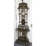 A decorative Victorian cast iron hall stand in Coalbrookdale style, with small mirror to back,